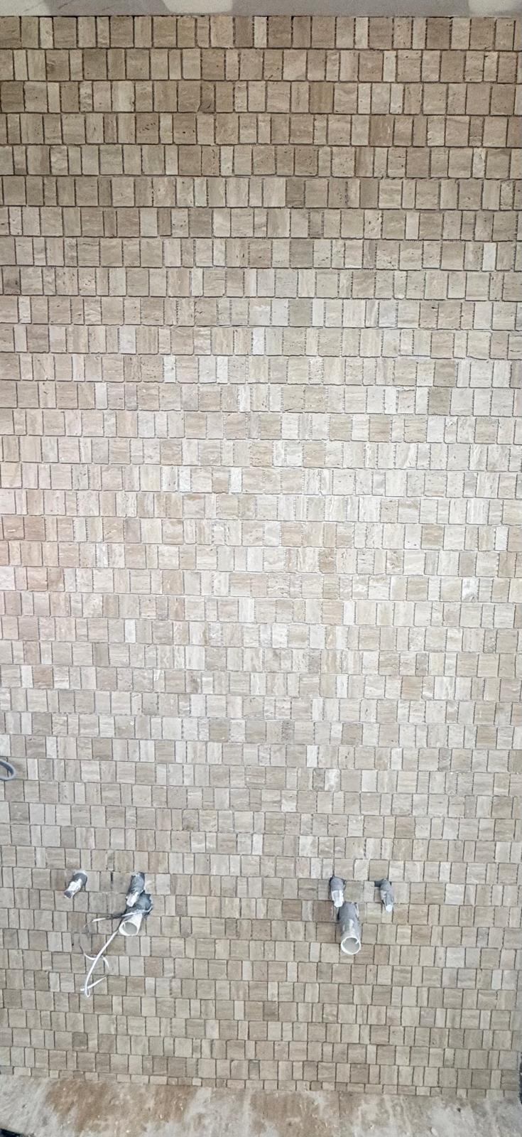 Travertine and mosaic tiling detail