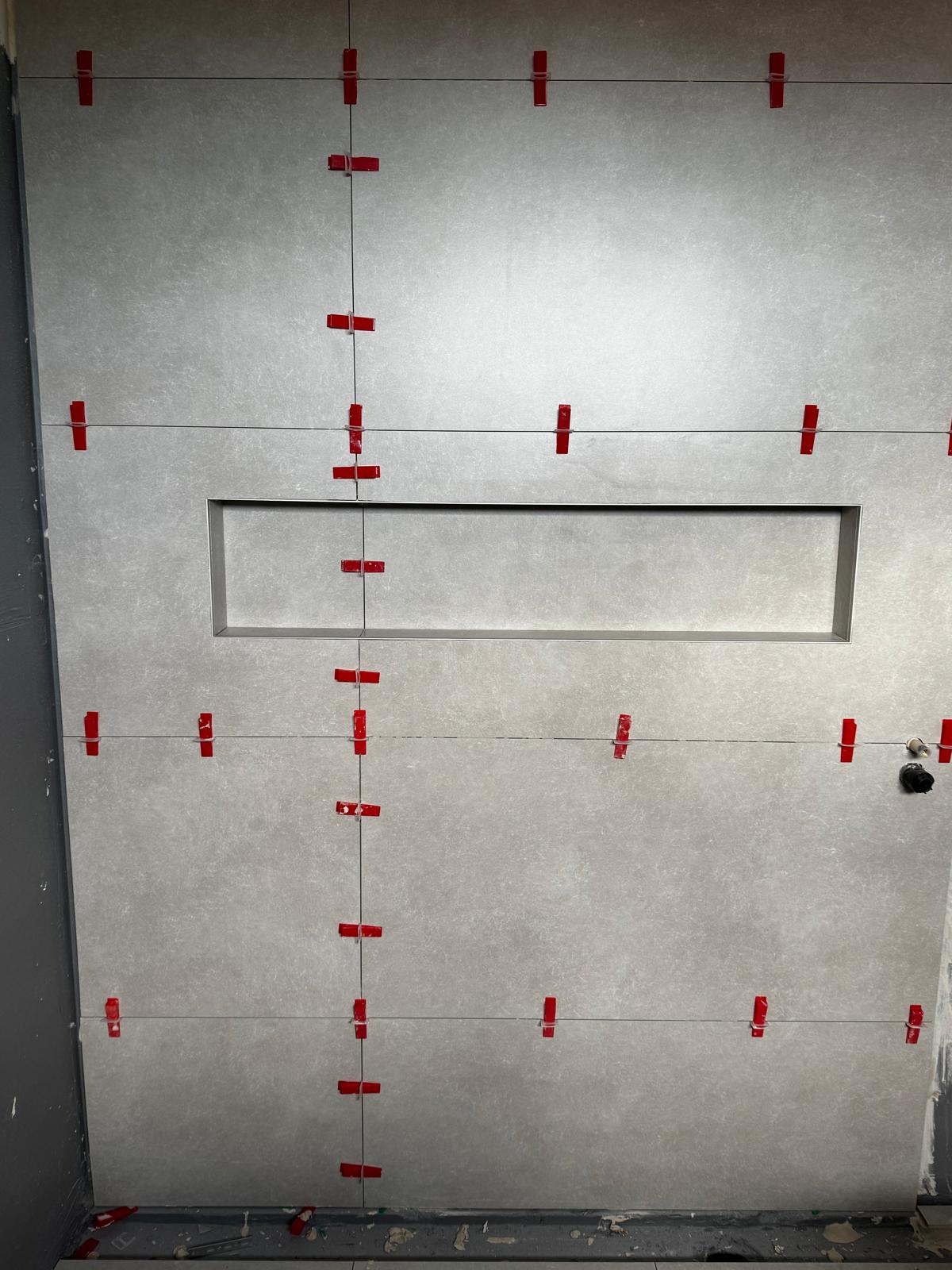 Shower wall with recessed niche